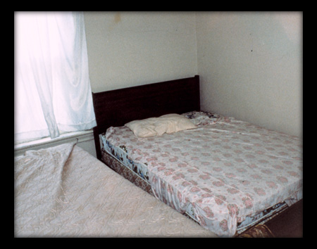 Bedroom #1 from the County Rd 24 & #10 Sideroad series.  C-print, 2001.